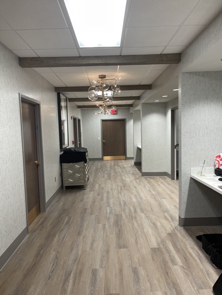 Modern medical practice interior, hallway with statement lighting